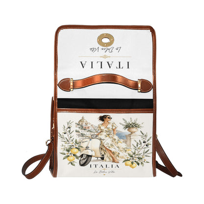 La Dolce Vita Damen-Handtasche - Italian Style mit Zitronenmotiven, Vespa-Detail und braunen Akzenten.