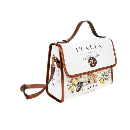 La Dolce Vita Damen-Handtasche – Italian Style: weiße Front mit Zitronen‑Motiven, Vespa‑Detail und braunen Lederkanten